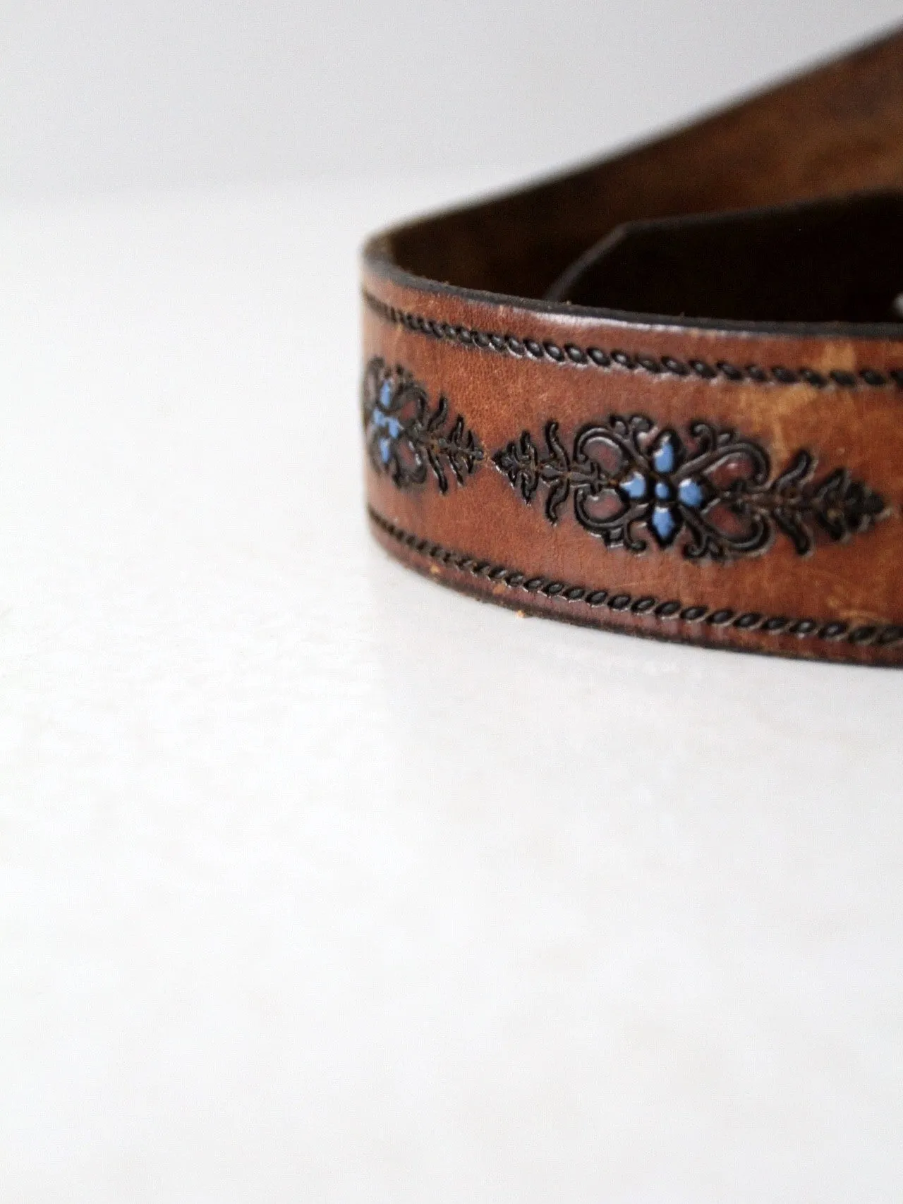 vintage 70s tooled leather belt with blue floral detail