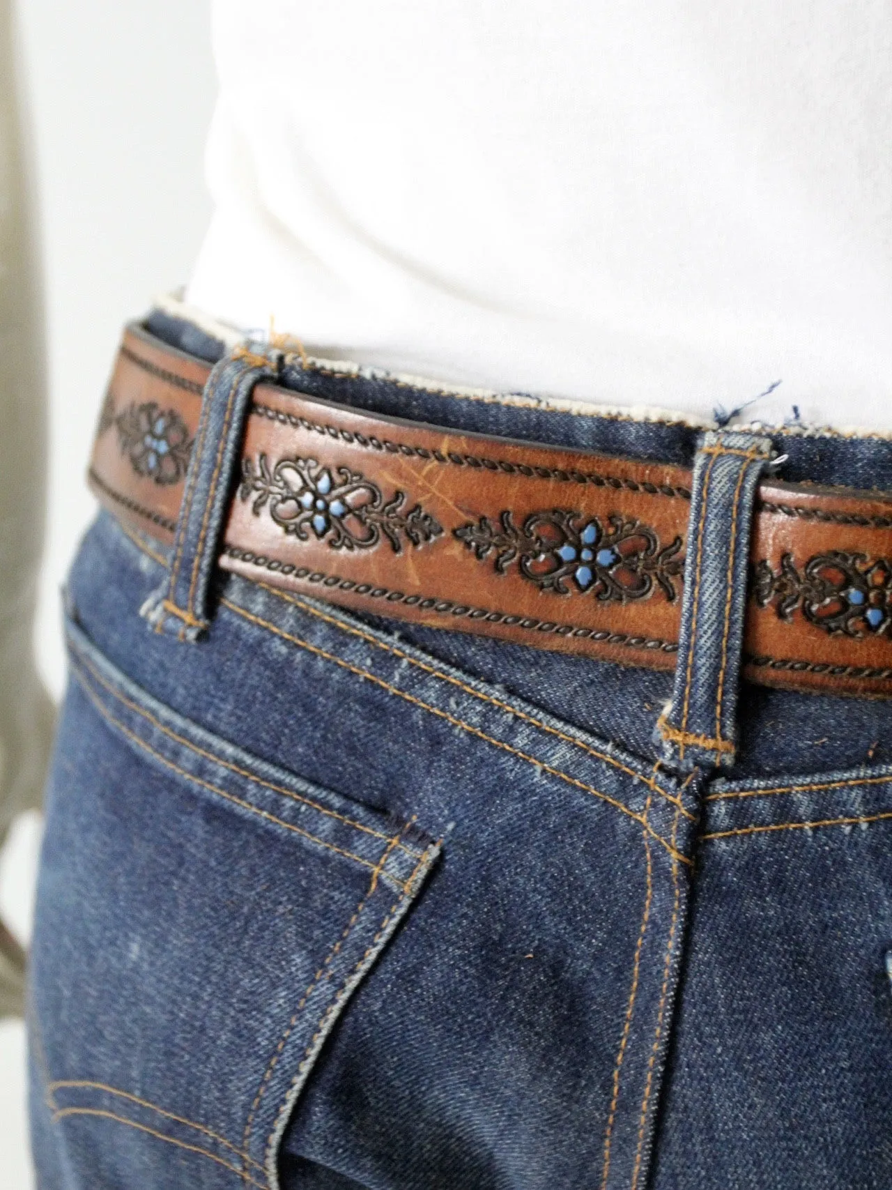 vintage 70s tooled leather belt with blue floral detail